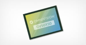 A rectangular electronic chip with a gradient blue and yellow design. The words "OmniVision OV50X50" are printed on its surface. The image has a light gray background.